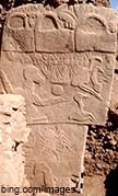 image of a pillar at gobekli tepi with carvings of various animals
